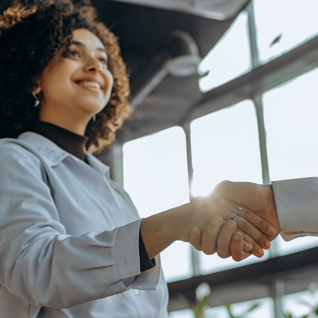 assessor shaking hands with client